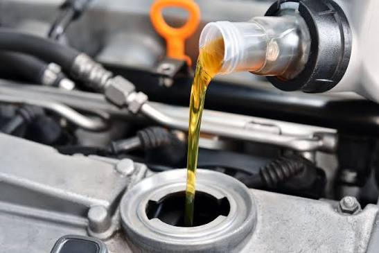 Engine oil being poured during car oil service